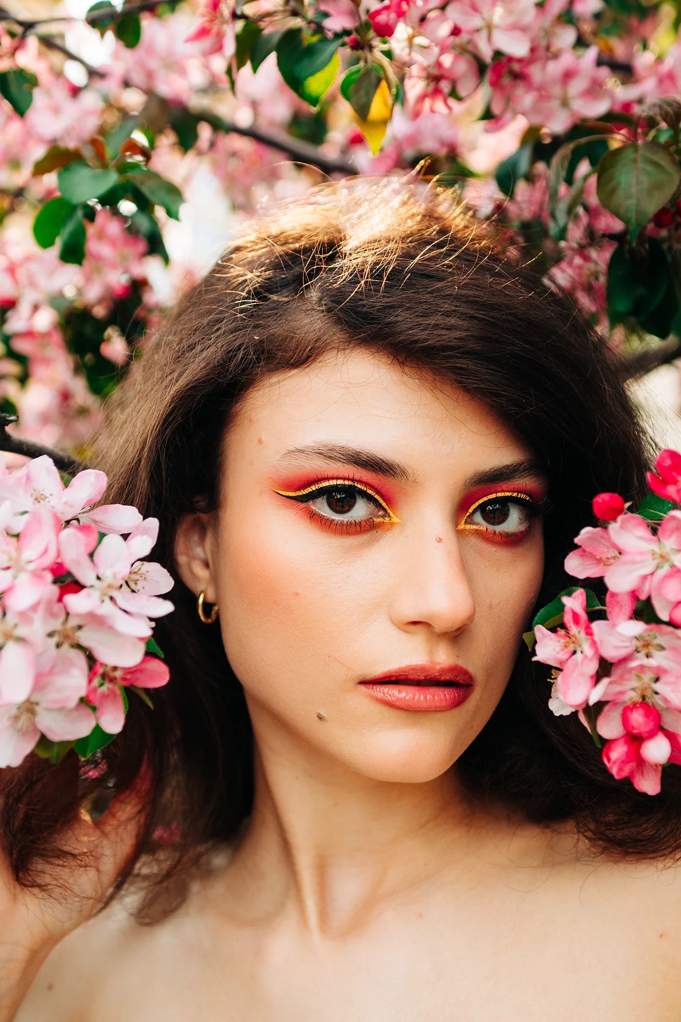 AI Preset Lab Magic AI Kodak Ektar 100 Lightroom Film Preset applied to a fashion portrait of a model surrounded by flowers.