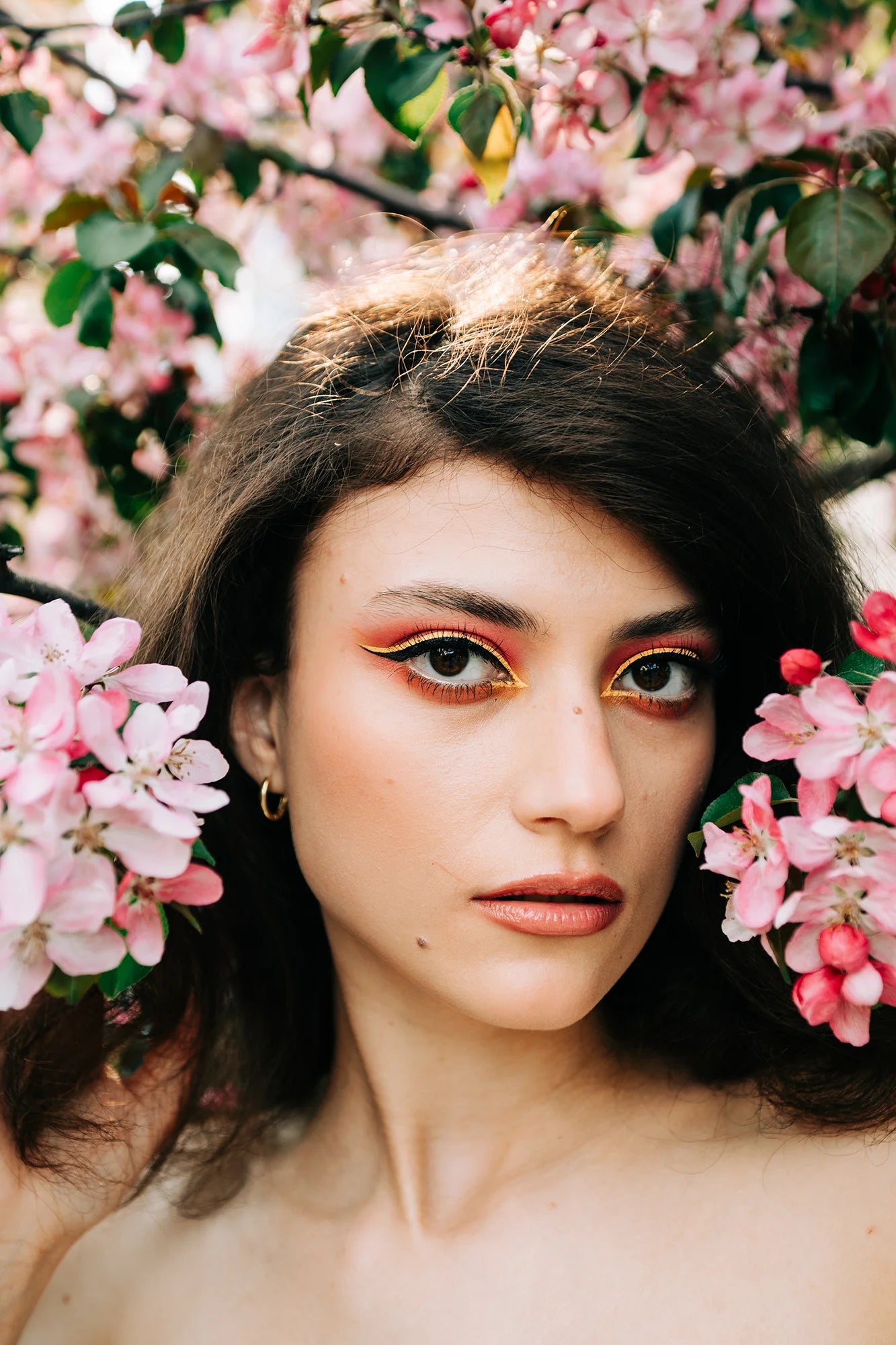AI Preset Lab Magic AI Kodak Gold 200 Lightroom Film Preset applied to a fashion portrait of a model surrounded by flowers.